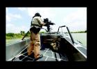 A Texas Parks and Wildlife warden patrols the Rio Grande in July, 2014.